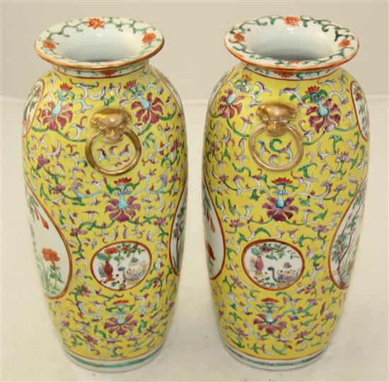 A pair of Chinese yellow ground famille rose vases, Jiaqing marks, early 20th century, 23cm